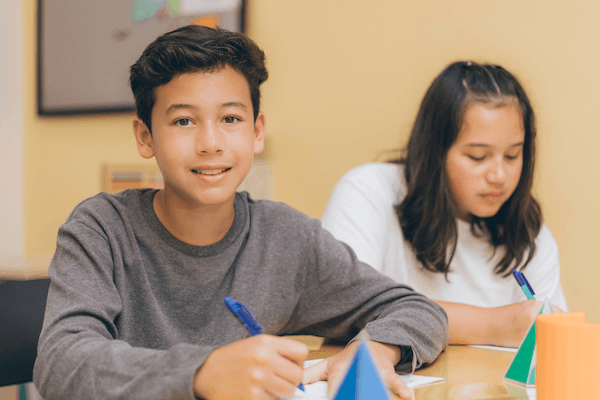 Students learning Singapore Math with teacher