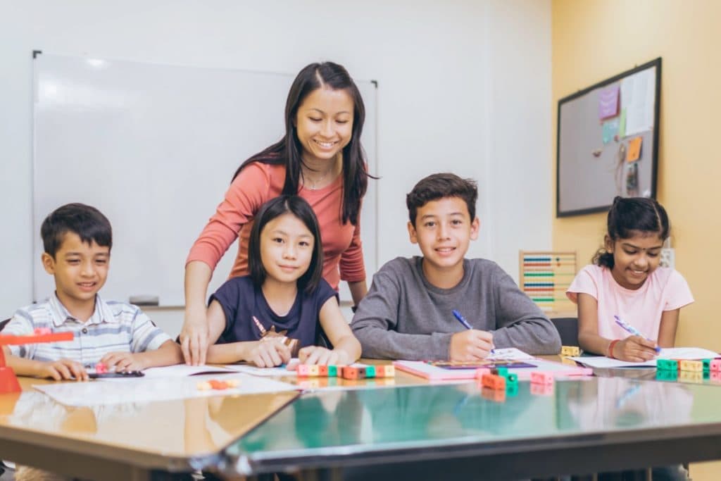 Students learning Singapore Math with teacher